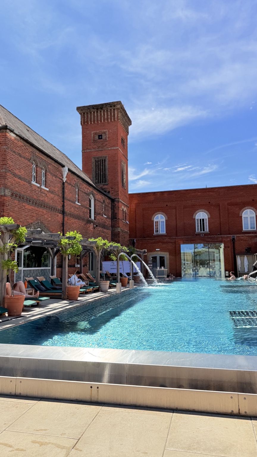 Eden Hall historic red-brick spa building beside the outdoor pool